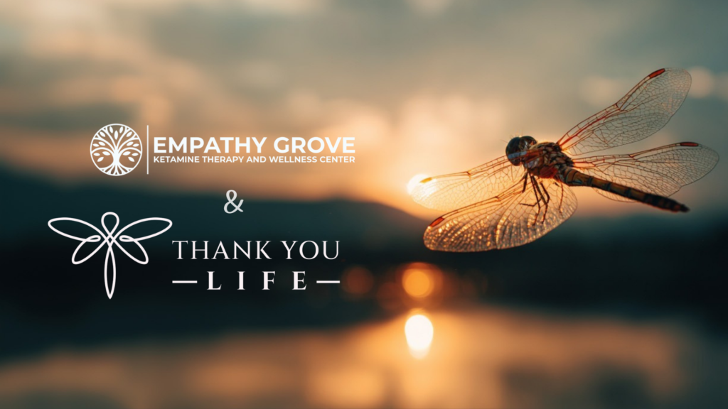 A dragonfly in focus with a blurred sunset background. Text reads: Empathy Grove Ketamine Therapy and Wellness Center & Thank You Life, our Life Sponsor, with their respective logos.